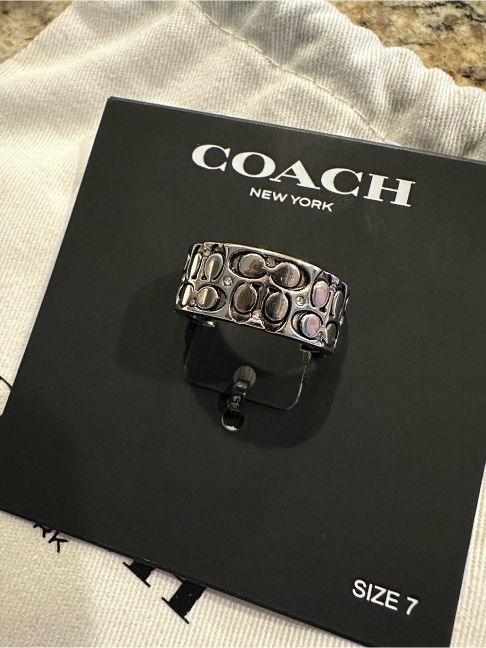 Coach Silver-Tone Crystal Quilted C
Wide Band Ring - Size 7 - Picture 2 of 3